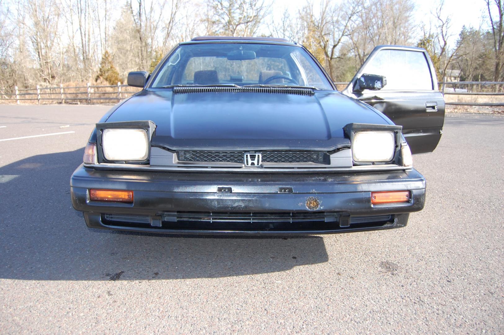 1987 Black /Gray Honda Prelude Si (JHMBA3248HC) with an 2.0L 4 cylinder engine, Automatic transmission, located at 6528 Lower York Road, New Hope, PA, 18938, (215) 862-9555, 40.358707, -74.977882 - Here we have a 1987 Honda Prelude SI with a 2.0L 4 cylinder putting power to the front wheels via an automatic transmission. Options include: gray cloth, power windows/locks/mirrors, AM/FM/TAPE radio, heat/AC, cruise control, tilt steering wheel, 13 inch alloy wheels, pop up headlights and a moon ro - Photo#21